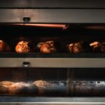 Warm artisan bread being baked to perfection in a professional industrial oven. - Photo by Chris F on Pexels