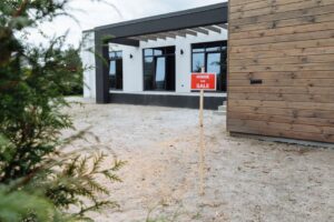 Modern house exterior with a 'Home for Sale' sign in front yard. - Photo by Thirdman on Pexels