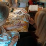 An elderly woman receives medication assistance at home, emphasizing home healthcare and caregiver support. - Photo by Jsme MILA on Pexels