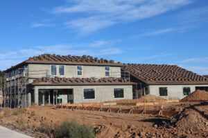 A modern suburban house under construction against a clear blue sky. - Photo by D Goug on Pexels