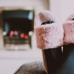 Relaxing by the fireplace with fuzzy slippers and warm socks indoors. - Photo by Lisa Fotios on Pexels